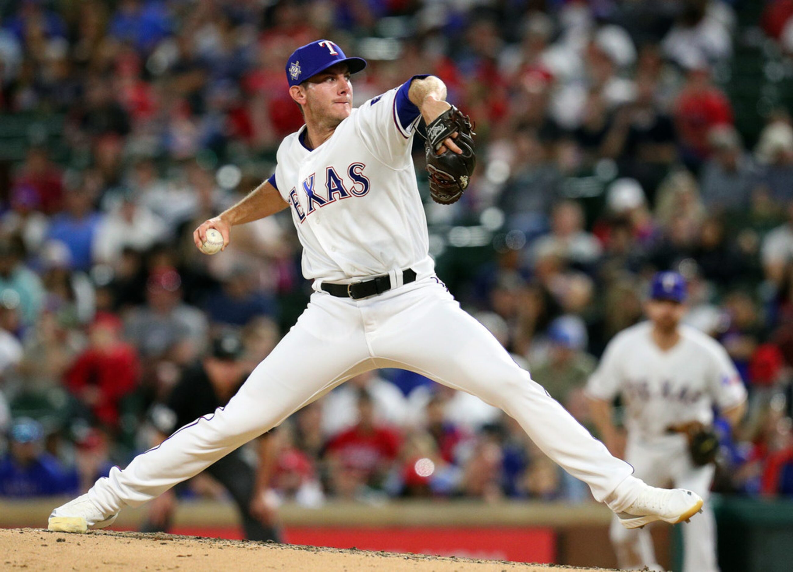 ARLINGTON, TEXAS - APRIL 15: Kyle Dowdy #43 of the Texas Rangers pitches in the fifth inning...