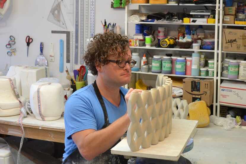 Artist Brooks Oliver works in his studio. Oliver's piece for Art Quest will be hidden at...