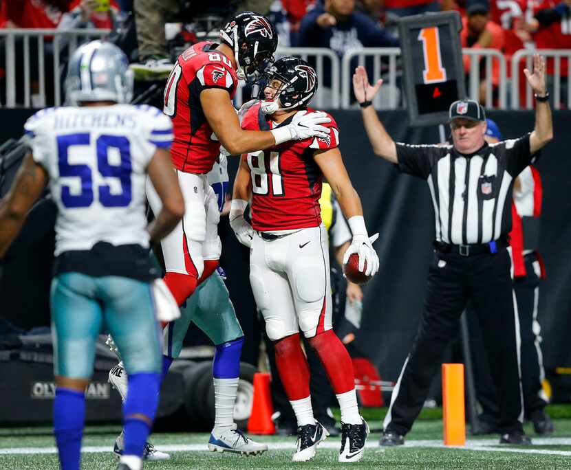 Atlanta Falcons tight end Austin Hooper (81) is congratulated on his fourth quarter...