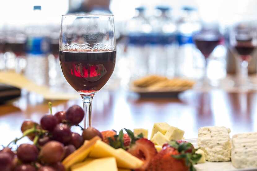 A glass of wine with a cheese and fruit plate during a panel tasting of Anderson Valley...