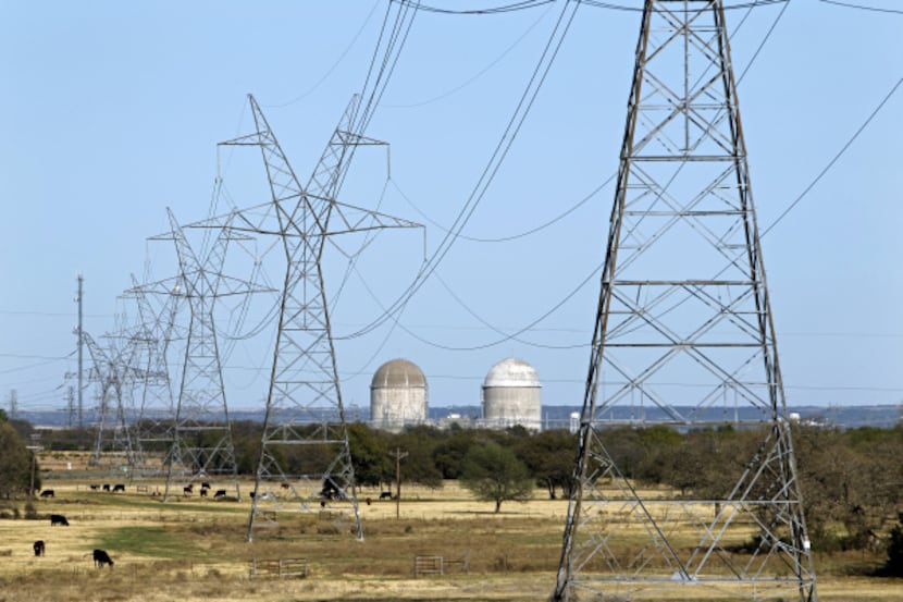 Electrical transmission lines lead to the Comanche Peak Nuclear Power Plant near Glen Rose...