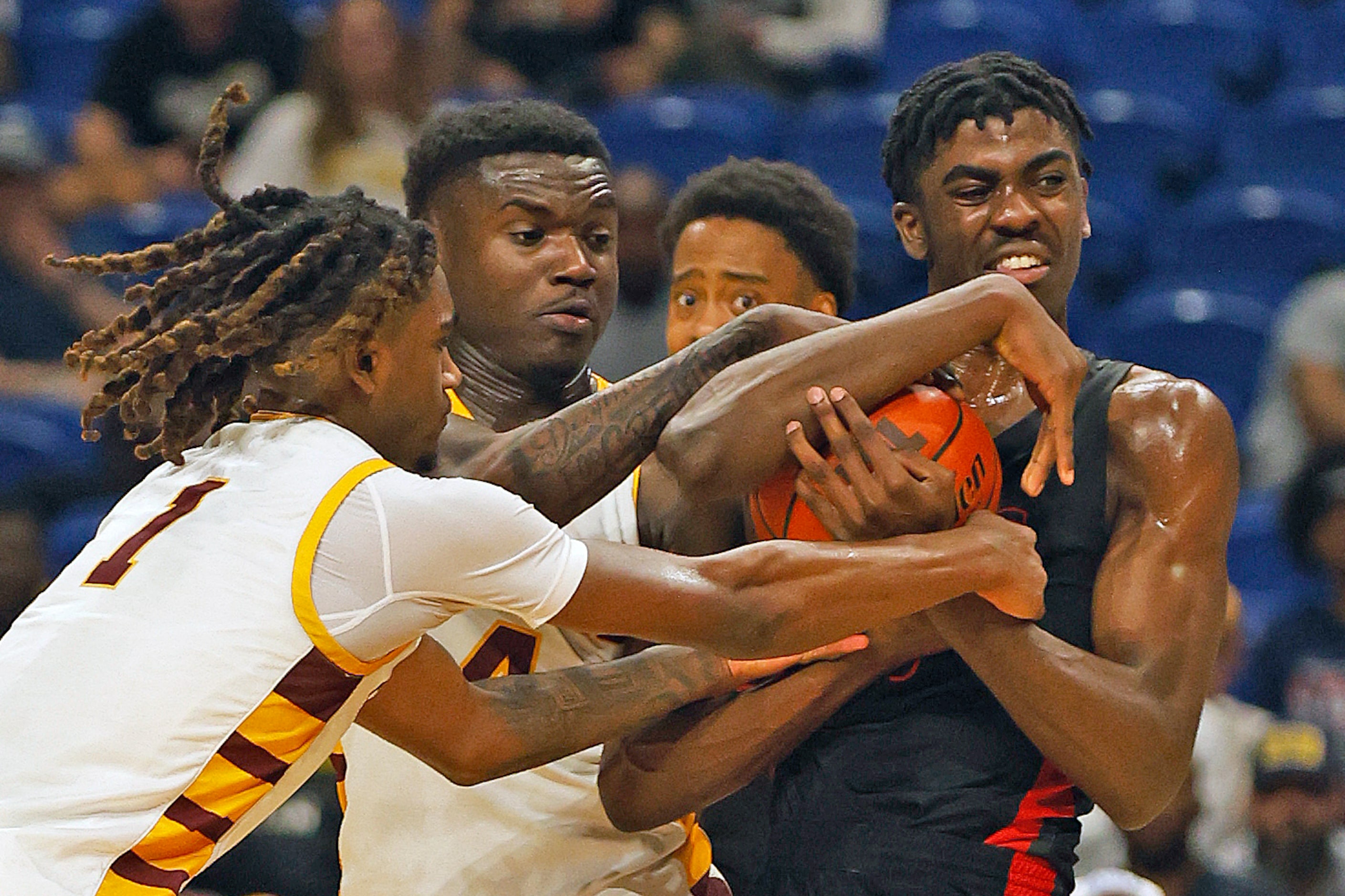 Lake Highlands Samson Aletan (10) fights off the pressure from Beaumont United Daniel...