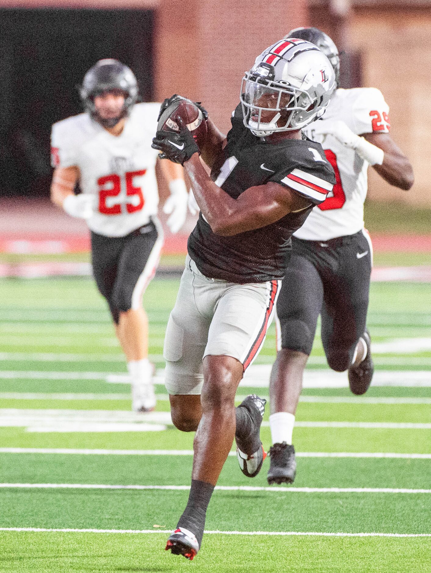 Lovejoy's wide receiver Kyle Parker (1) catches a pass in the first half during a high...