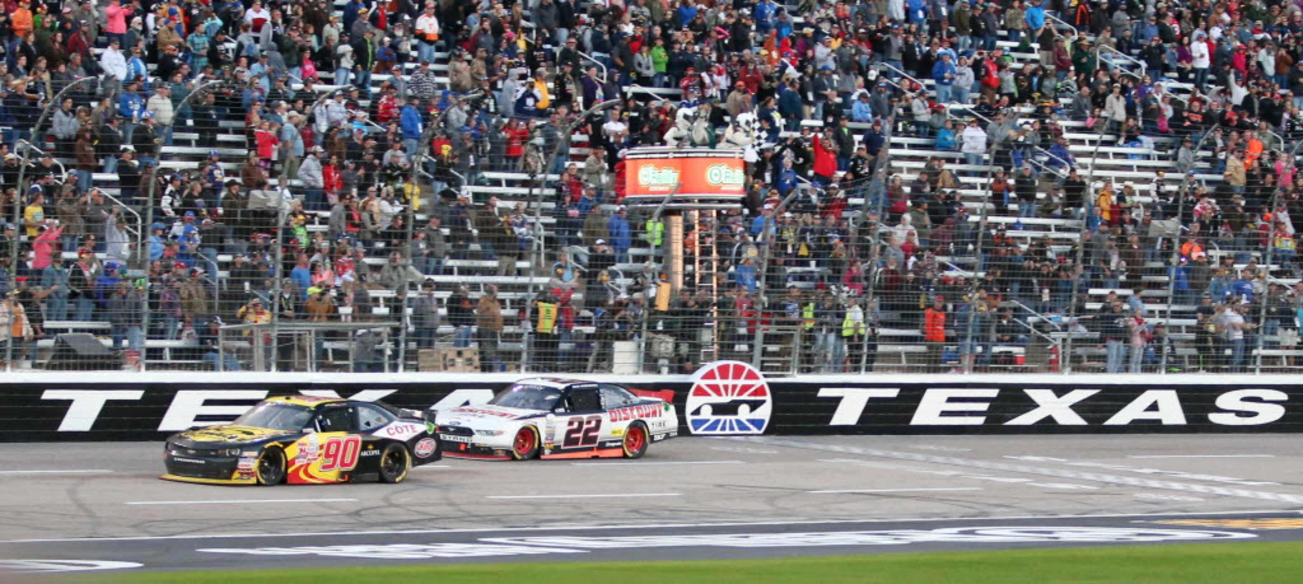 Brad Keselowski (22) crosses the finish line on the final lap during the NASCAR XFINITY...