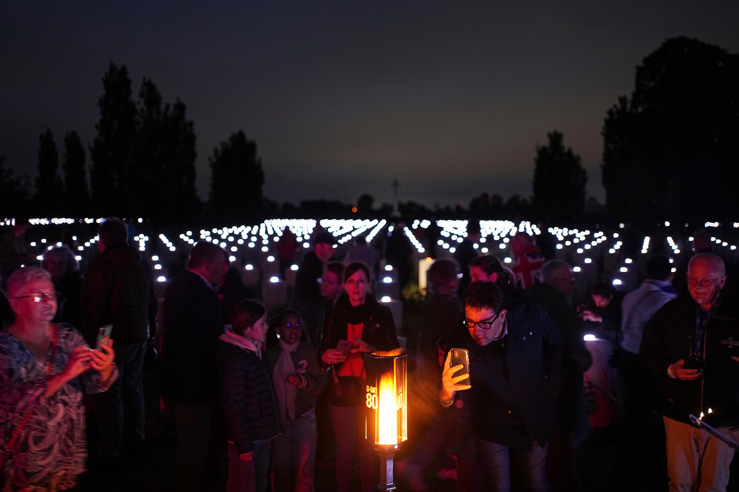 A flame shines in the Commonwealth war cemetery of Banneville-La-Campagne, Normandy, France,...