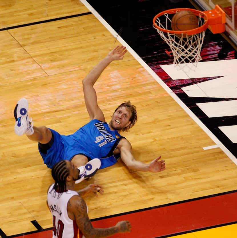 Dallas Mavericks power forward Dirk Nowitzki (41) watches as his shot falls through the...