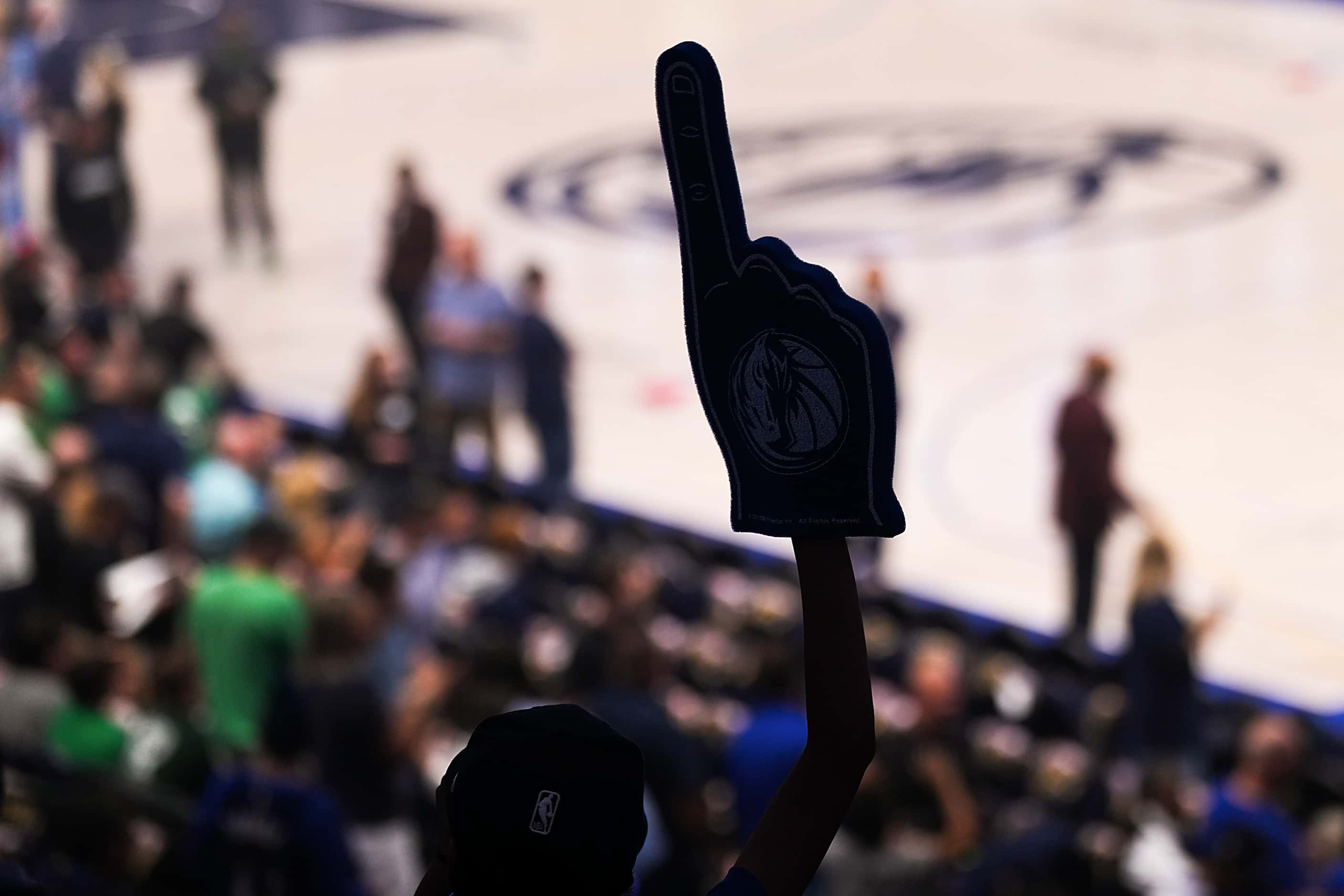 Dallas Mavericks fans cheer before their team takes the floor for first half in Game 4 of...