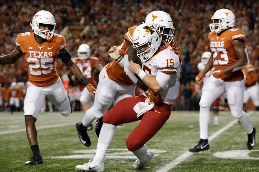 Texas linebacker Gary Johnson delivers a hit on Iowa State quarterback Brock Purdy. The...