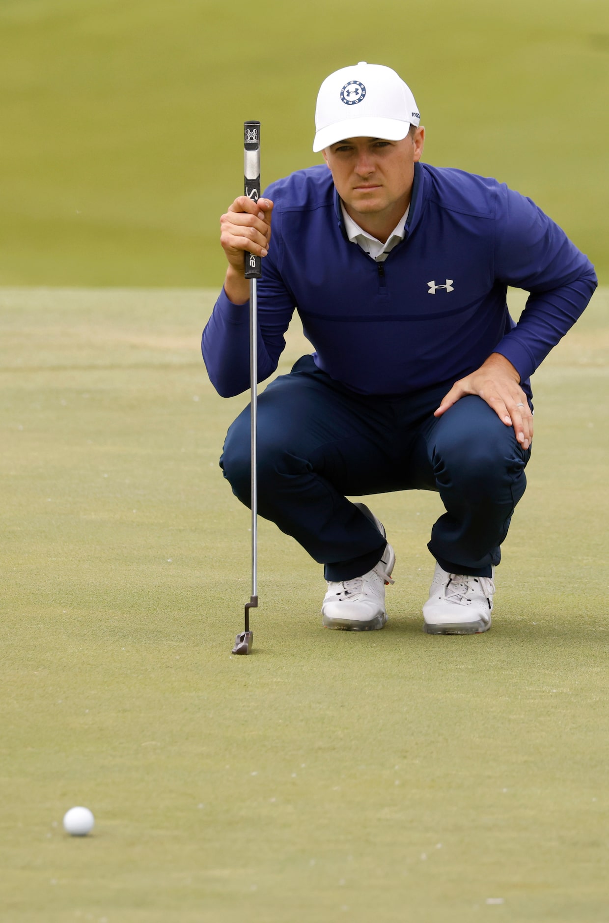 Jordan Spieth surveys the land before putting on the 6th hole during round 2 of the AT&T...