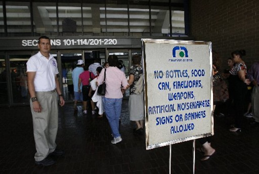  Cristian Torres with arena security watches as people file into Reunion for the...