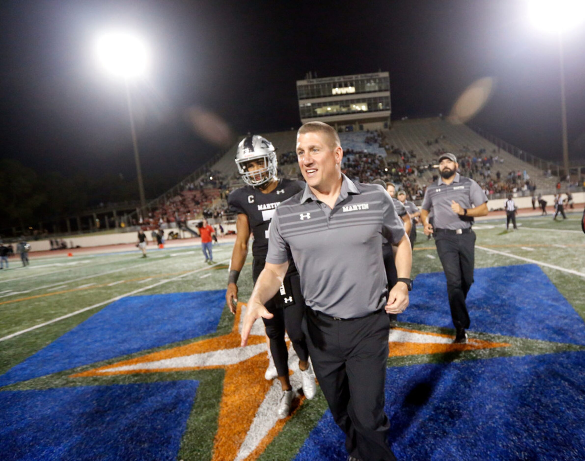 Arlington Martin coach Bob Wager celebrates after the Class 6A Division I area-round playoff...