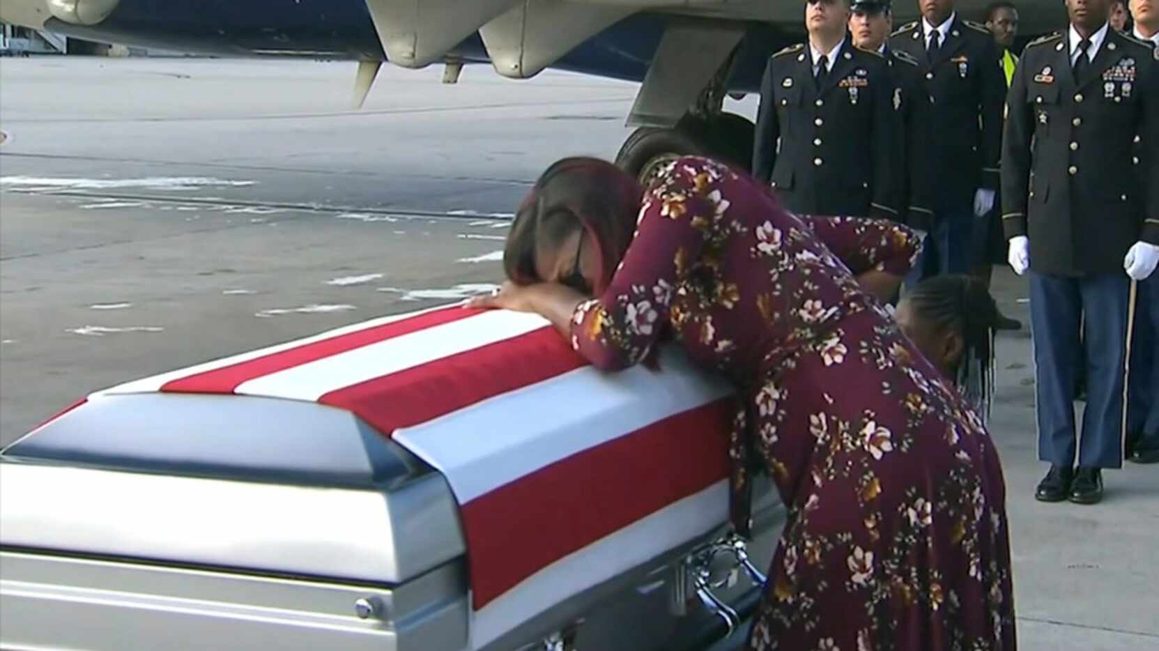 Myeshia Johnson cries over the casket of her husband, Sgt. La David Johnson, who was killed...