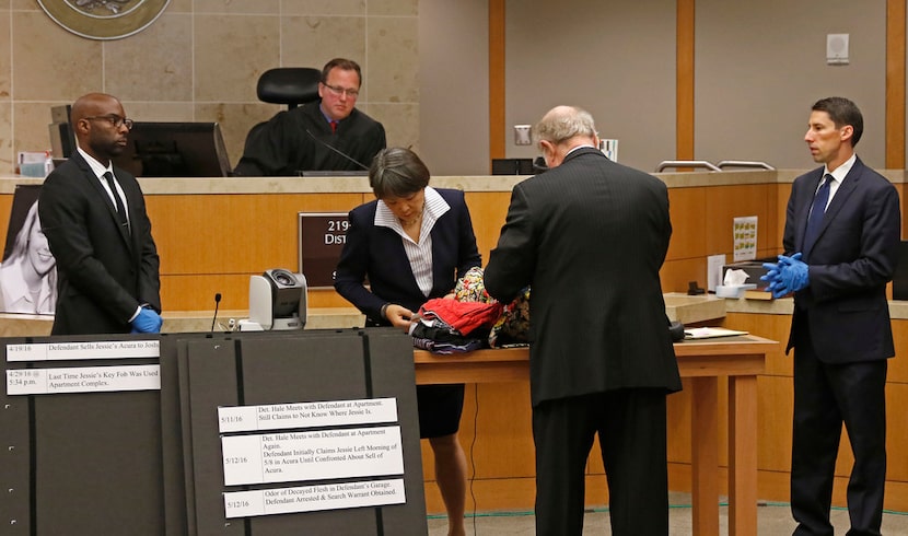 Defendant attorneys Andrew Farkas (second from right) and Maria Tu (standing to Farkas'...