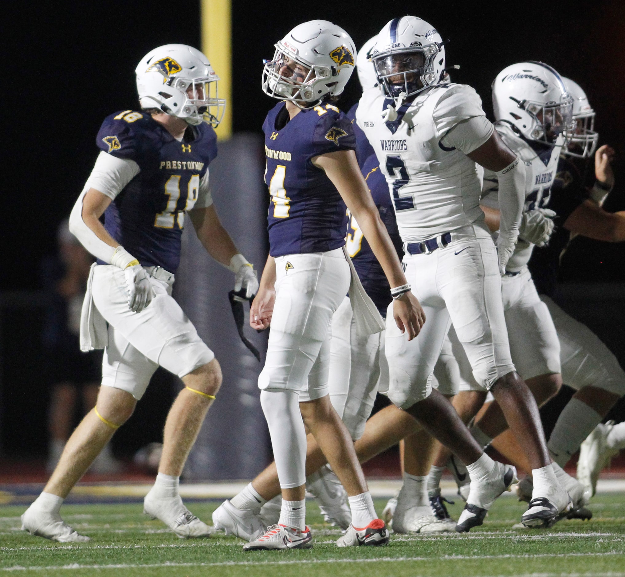 Plano Prestonwood Christian kicker Justin Dewers (14), center, reacts after his second...