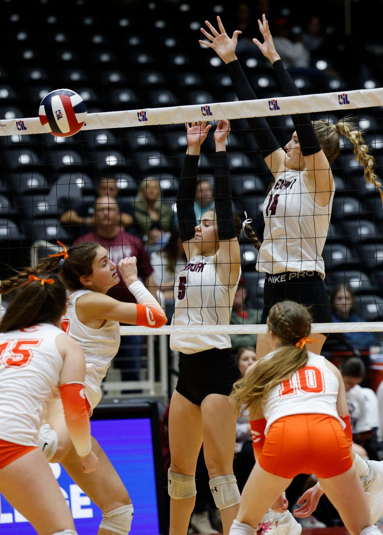 Comal Davenport's Comal Davenport's Lexi Dahl (5) and Comal Davenport's Emily Williams (14)...