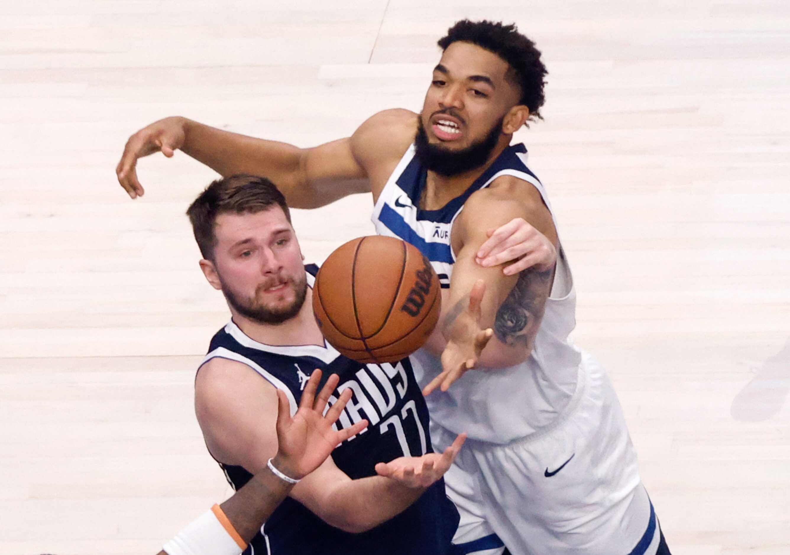 Dallas Mavericks guard Luka Doncic (77) and Minnesota Timberwolves center Karl-Anthony Towns...