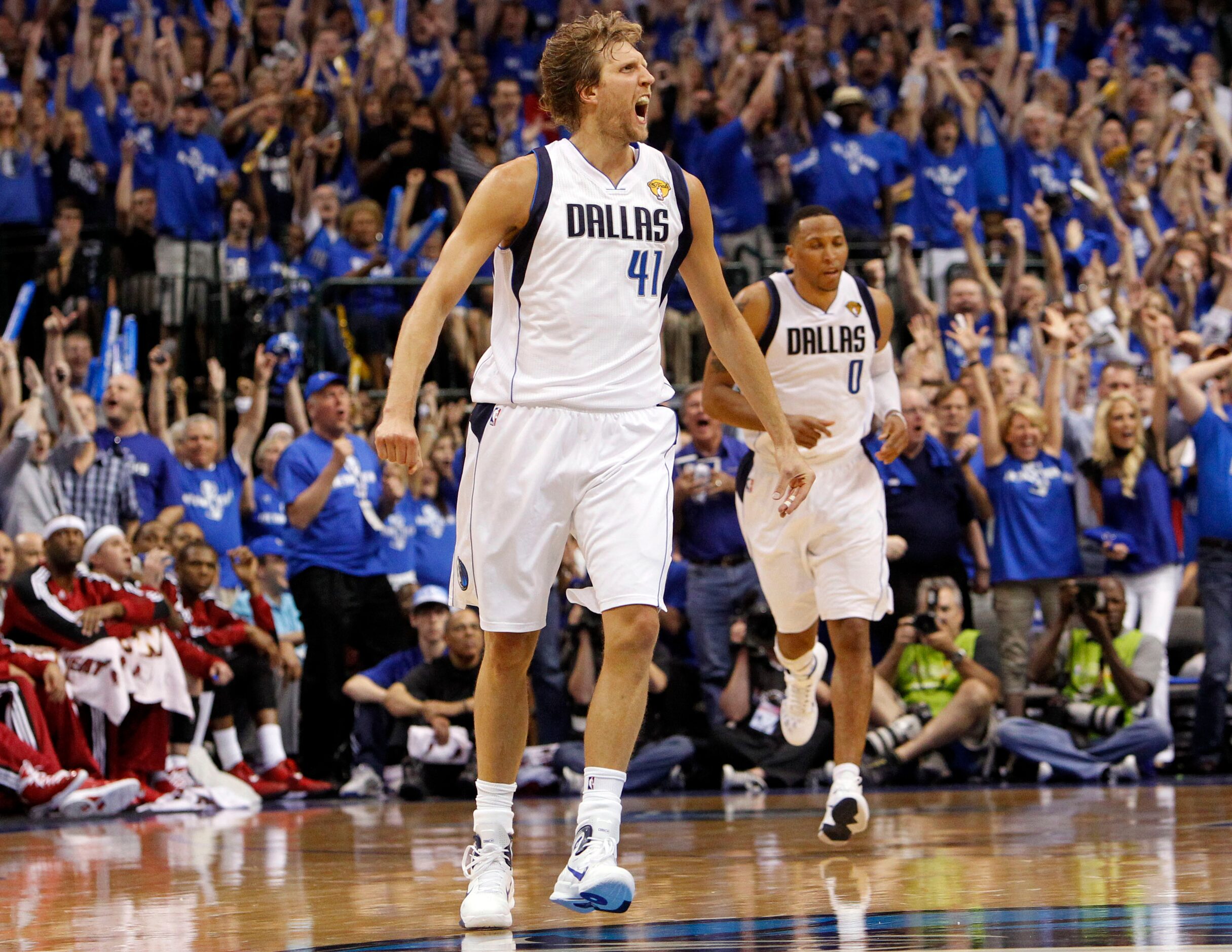 Dallas Mavericks power forward Dirk Nowitzki (41) reacts after hitting a three pointer...