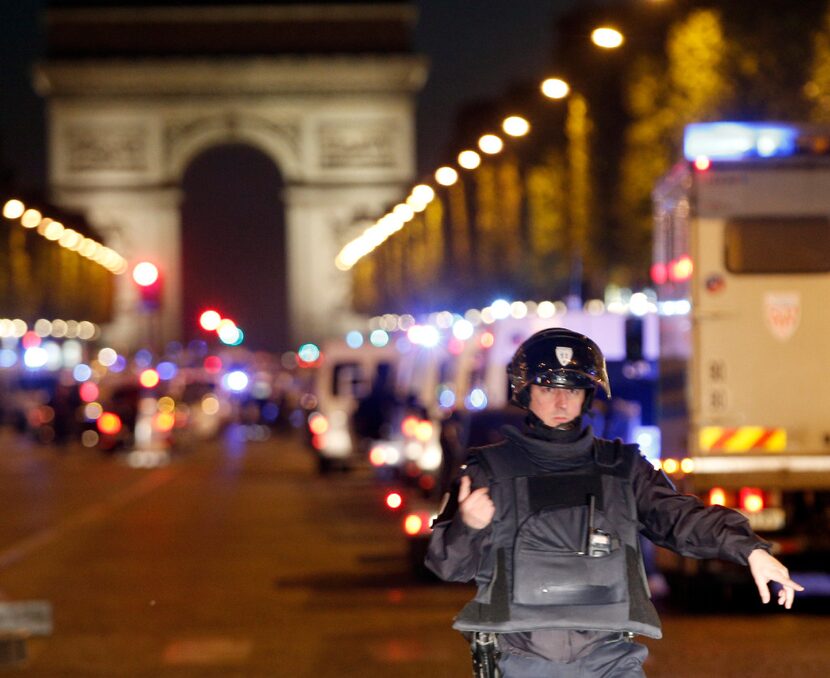 A police officer stands guard after a fatal shooting in which a police officer was killed...