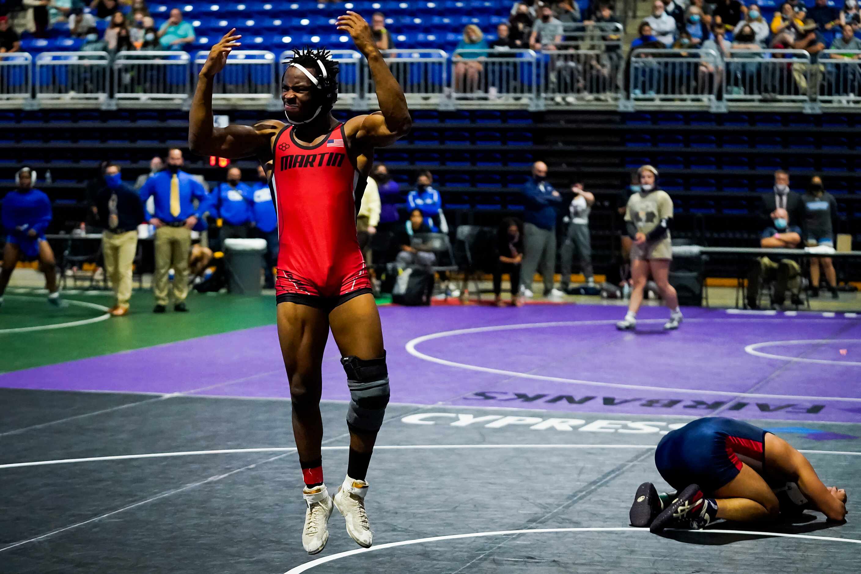 Sincere Bailey of Arlington Martin celebrates after defeating Caleb Mata of Houston Clear...