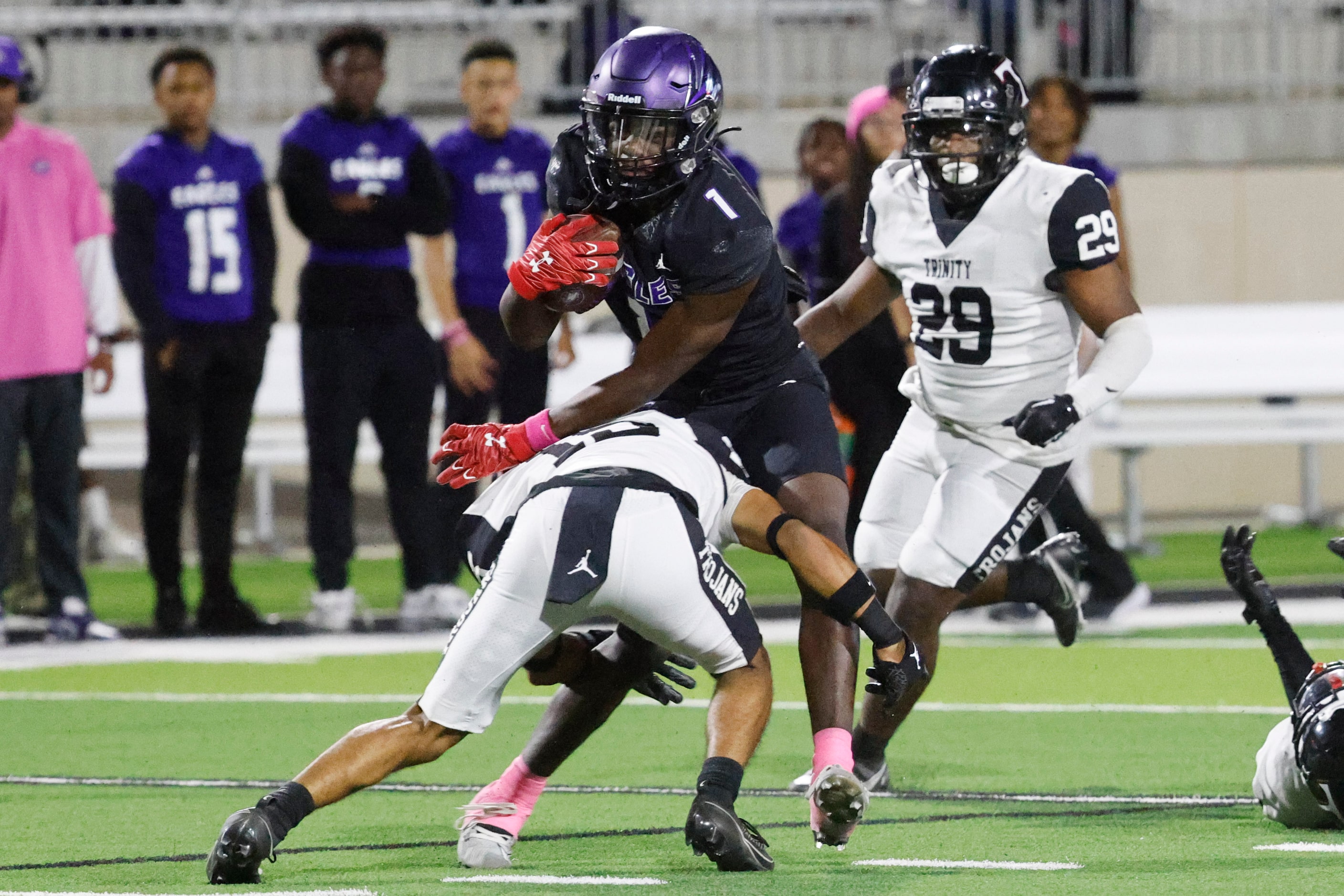 Crowley high’s Antayvious Ellis (1) gets tackled by Trinity High’s Kaden Donaldson (front)...