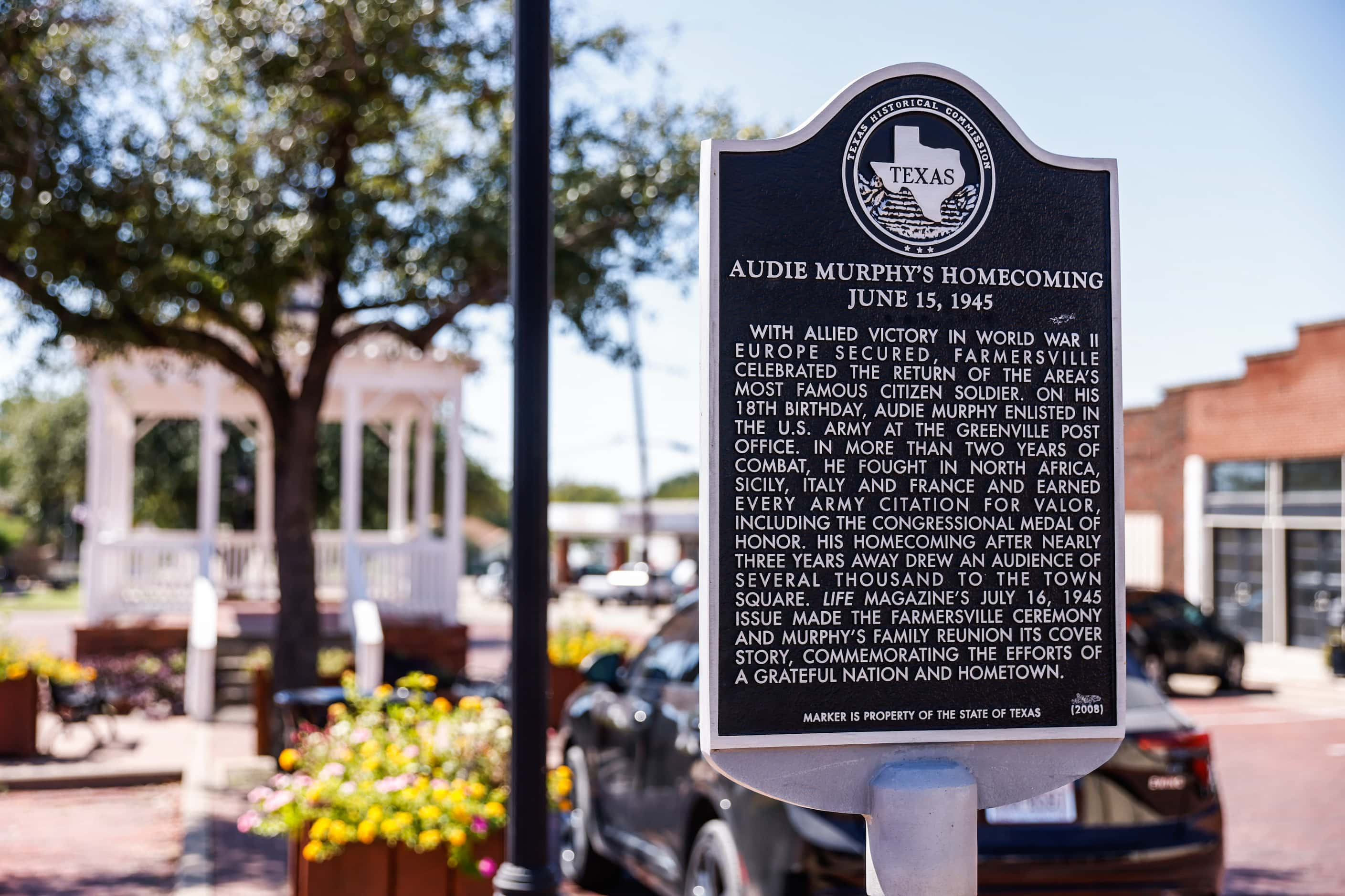 A historic marker in downtown Farmersville describes Audie Murphy's homecoming.