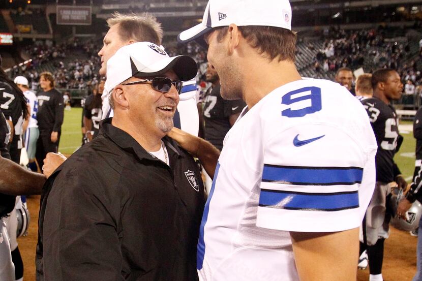 Dallas Cowboys quarterback Tony Romo (9) greets one of his former coaches and current...
