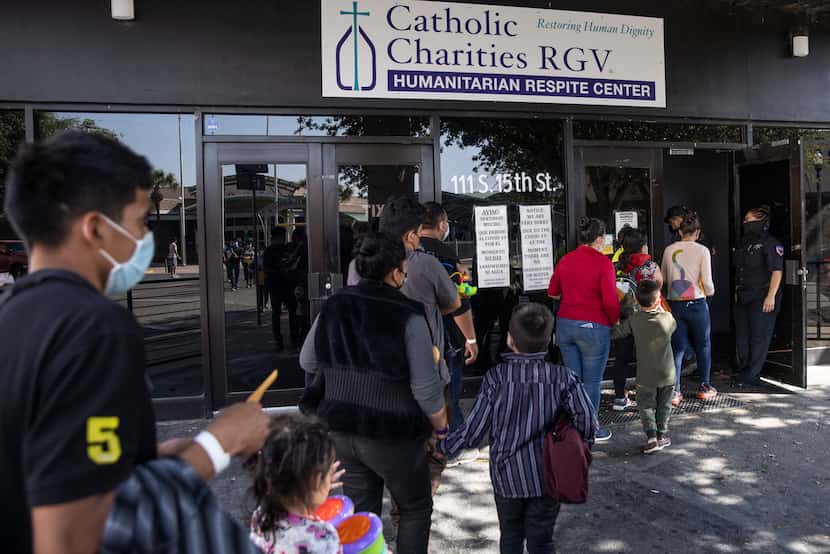 Families with very young children arrive at the Catholic Charities migrant respite center in...