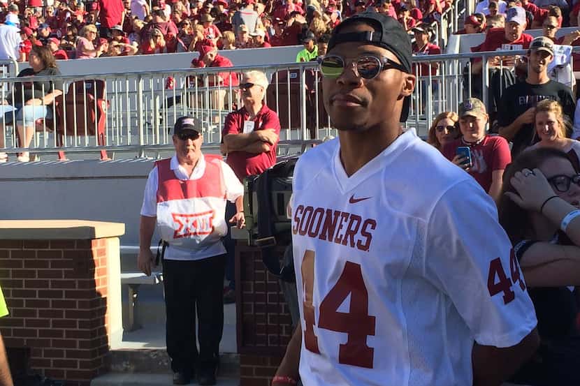 Russell Westbrook stands on the field of Gaylord Family-Oklahoma Memorial Stadium in a...