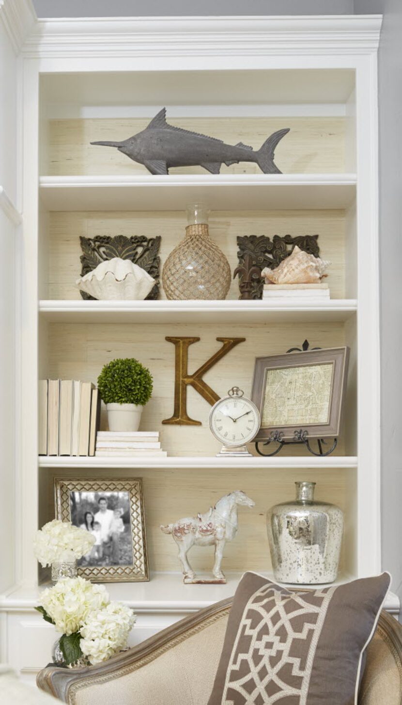 The key to an interesting bookcase is dimension. "Add layers! Start by incorporating a...