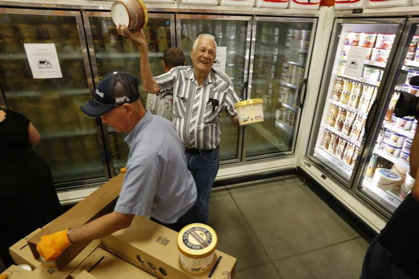  Fans of Blue Bell ice cream were happy to show off the containers as they were the first in...