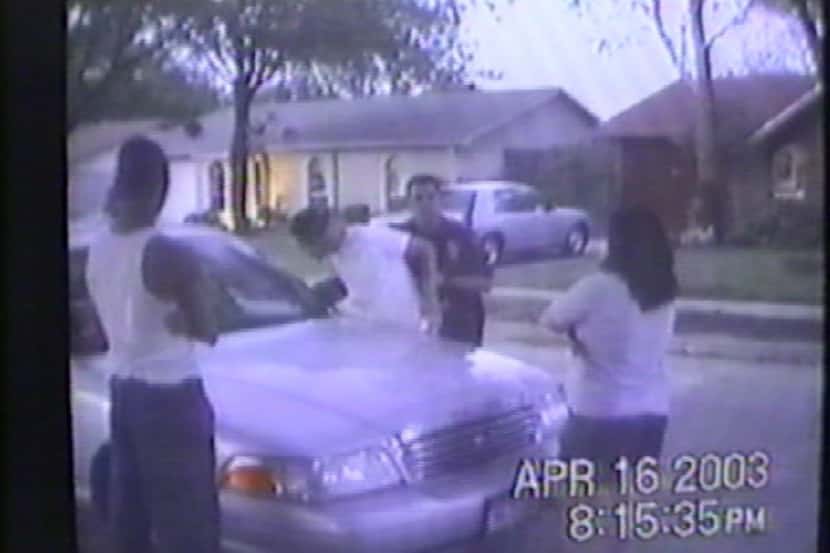 
Tammy Solis watches Plano police Officer Michael Weaver arrest one of her sons for walking...