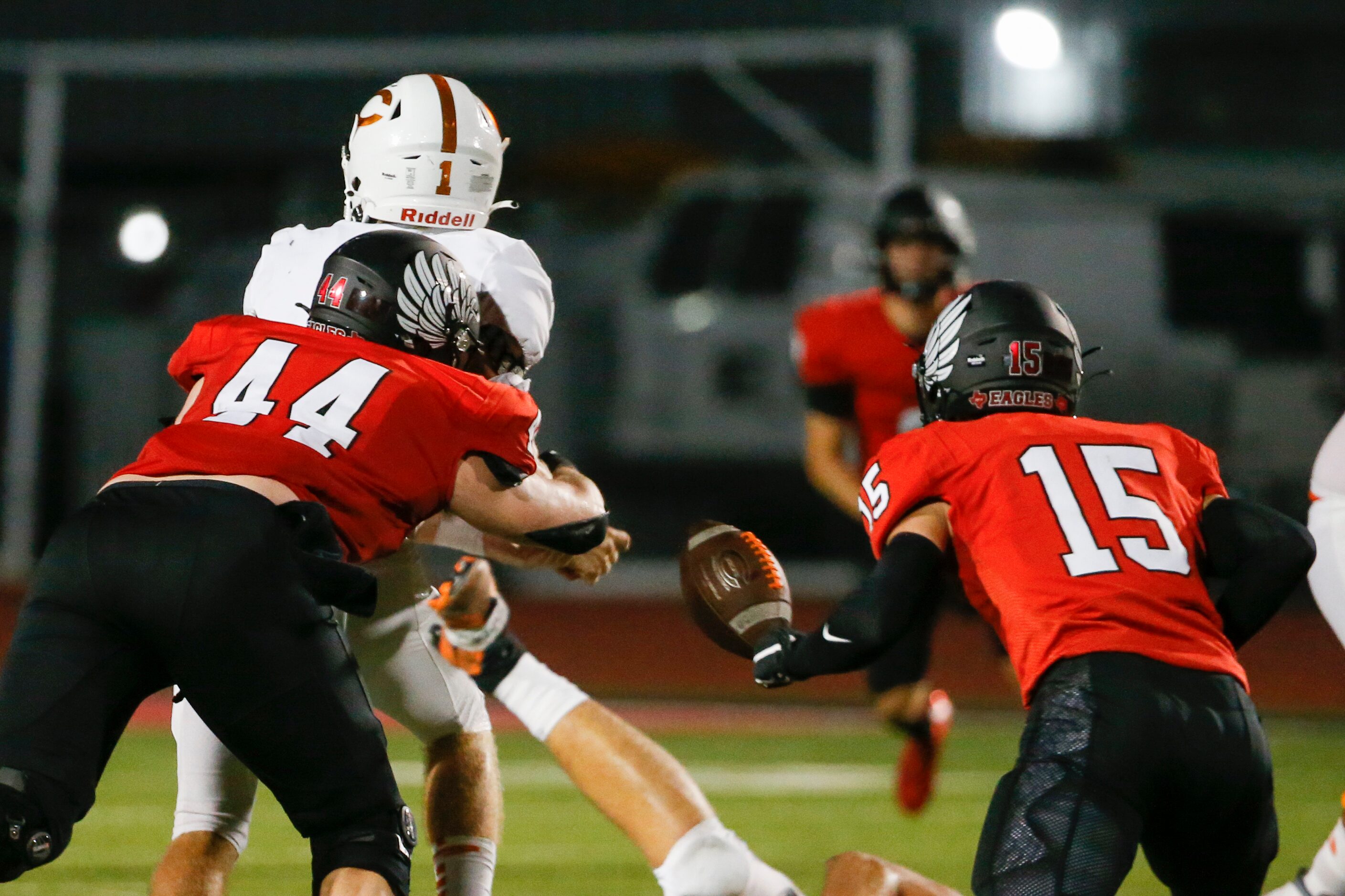 Argyle defensive lineman Riley Van Poppel (44) forces a fumble from Celina quarterback Noah...