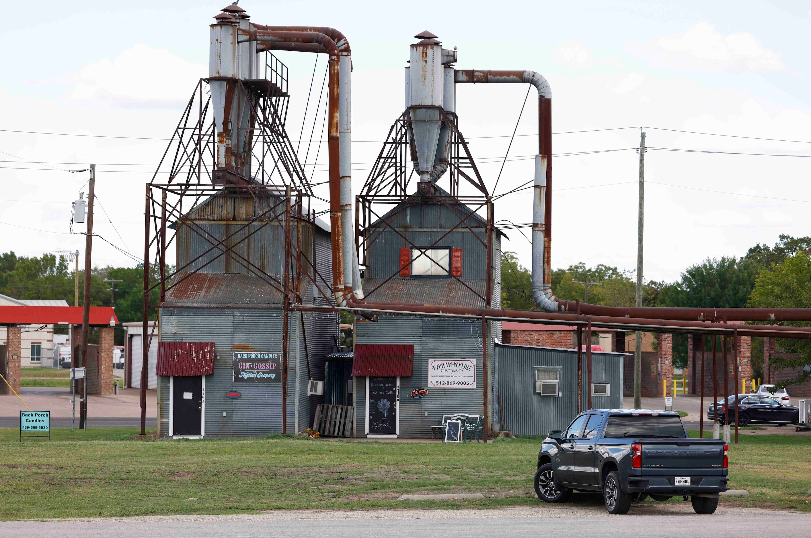 A candle shop, left, and a furniture shop in downtown Forney. 