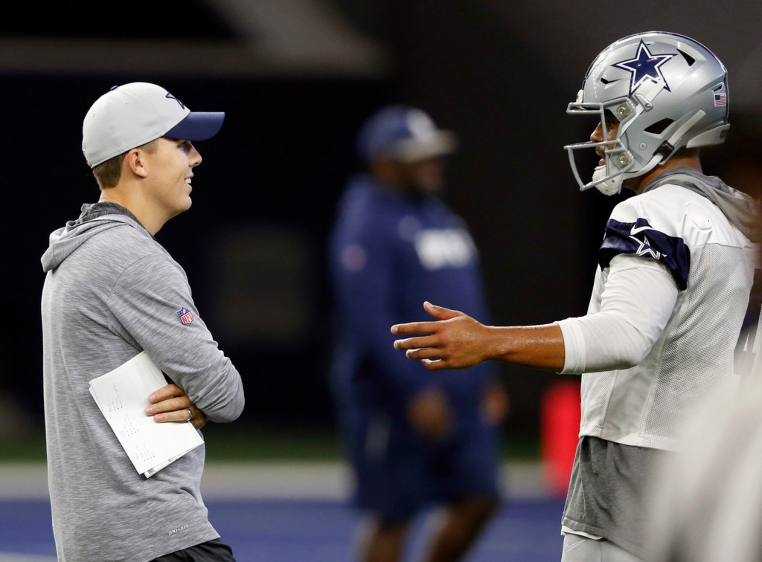 Dallas Cowboys offensive coordinator Kellen Moore and Dallas Cowboys quarterback Dak...