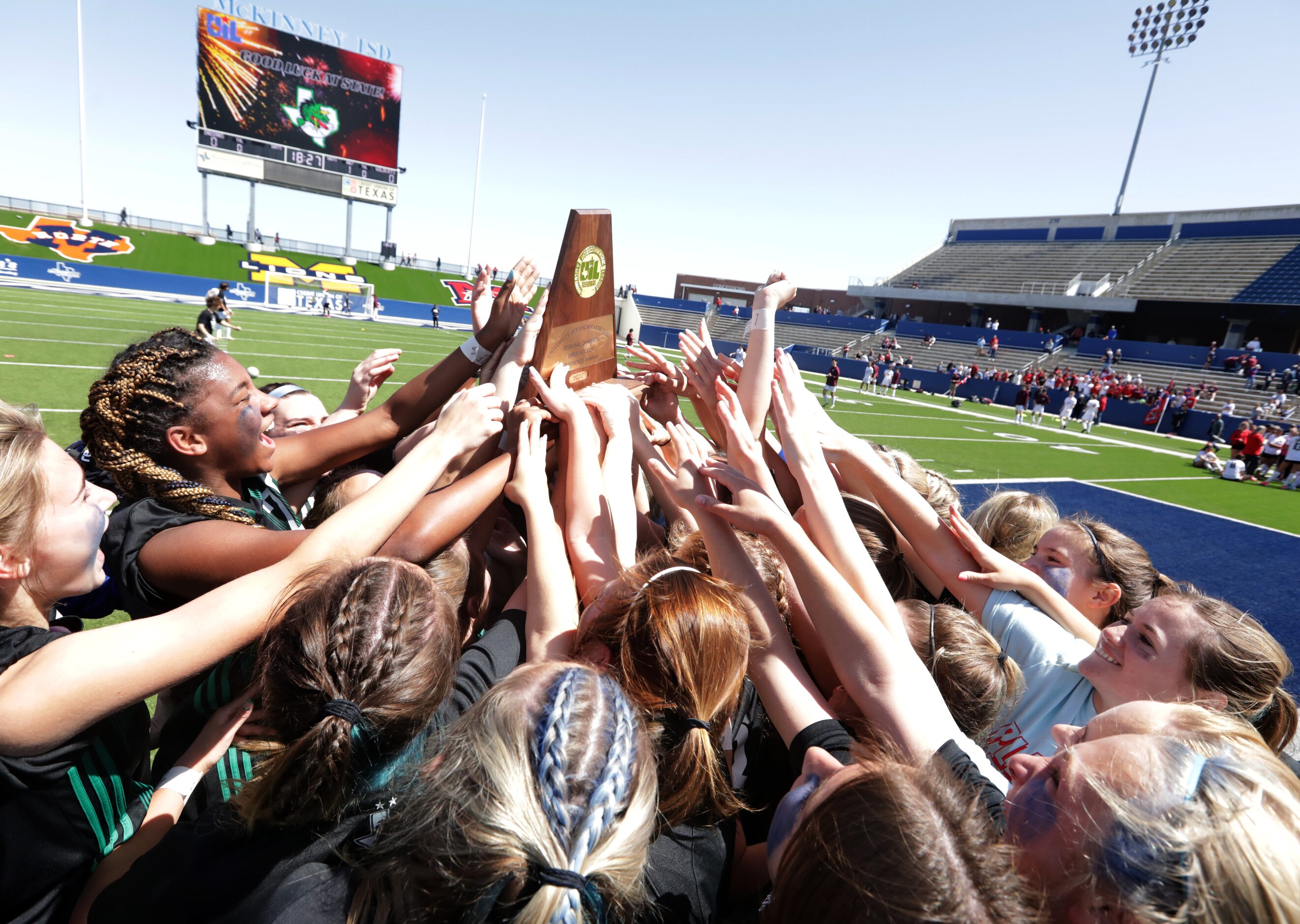 Southlake Carroll players celebrate after winning during a Class 6A Region I championship...