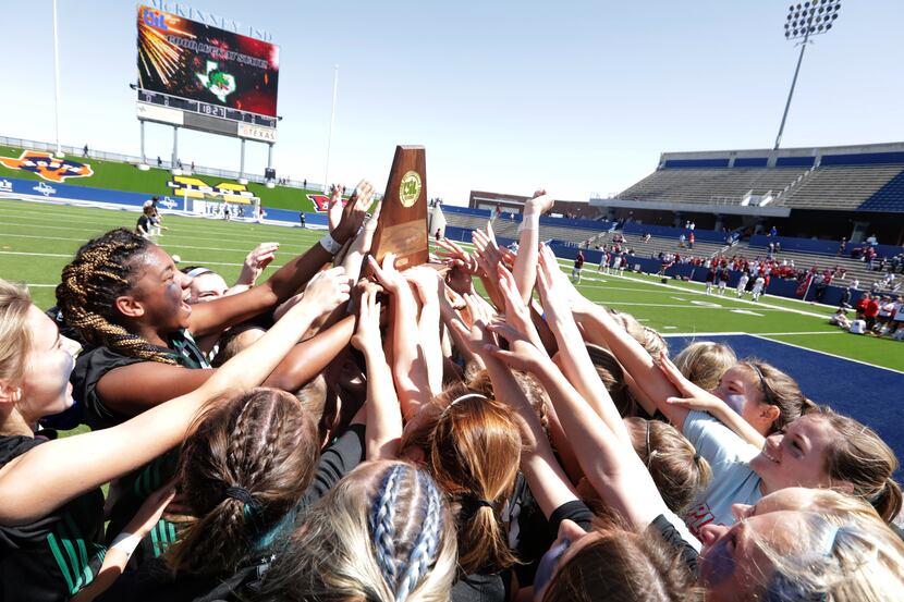 Southlake Carroll players celebrate after winning during a Class 6A Region I championship...
