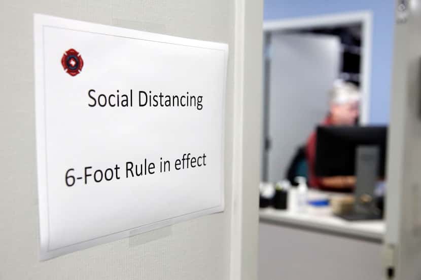 Signs outside the each office door of the Ott Cribbs Safety Center reminds workers to keep a...