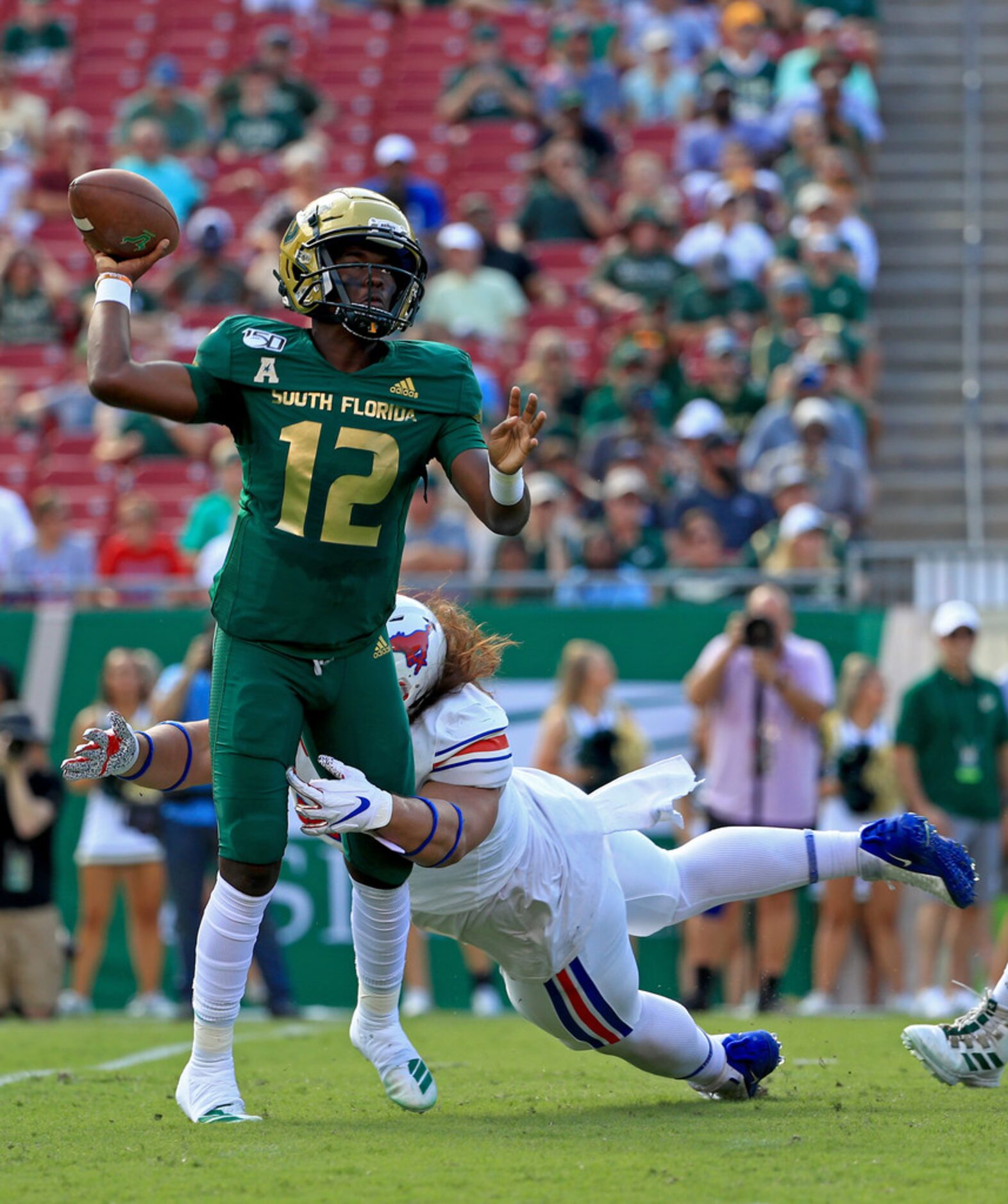 TAMPA, FLORIDA - SEPTEMBER 28:  Jordan McCloud #12 of the South Florida Bulls passes during...