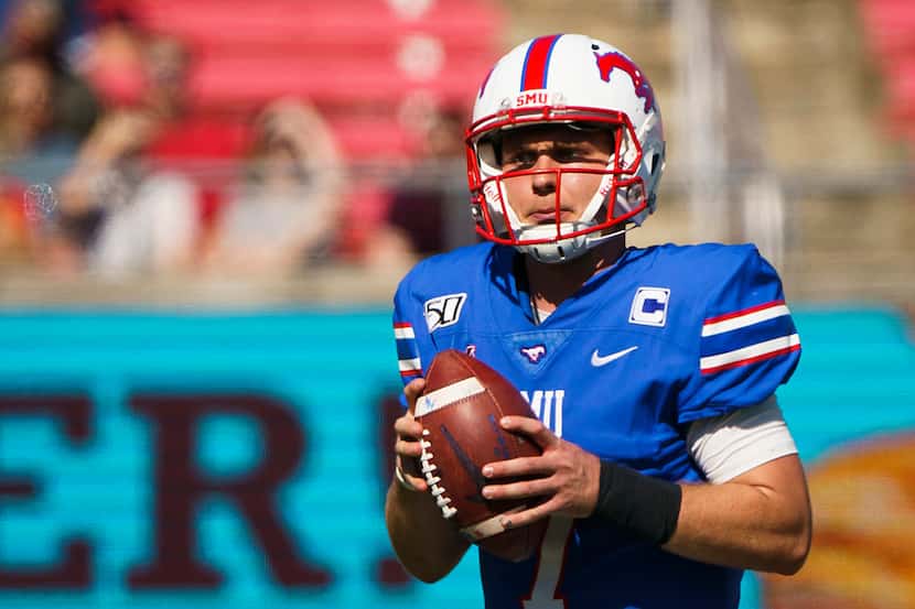 SMU quarterback Shane Buechele (7) looks to pass during the first half of an NCAA football...