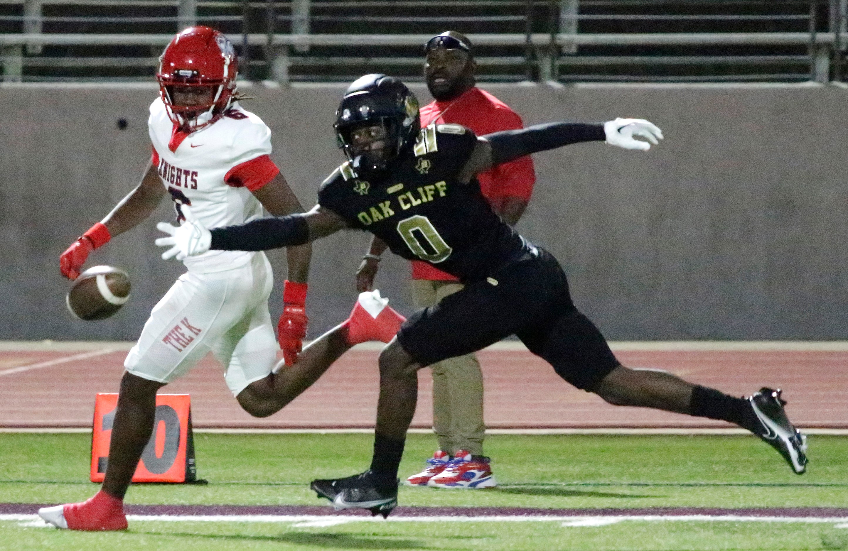 South Oak Cliff High School outside linebacker Brandon Jones (0) defends Kimball High School...