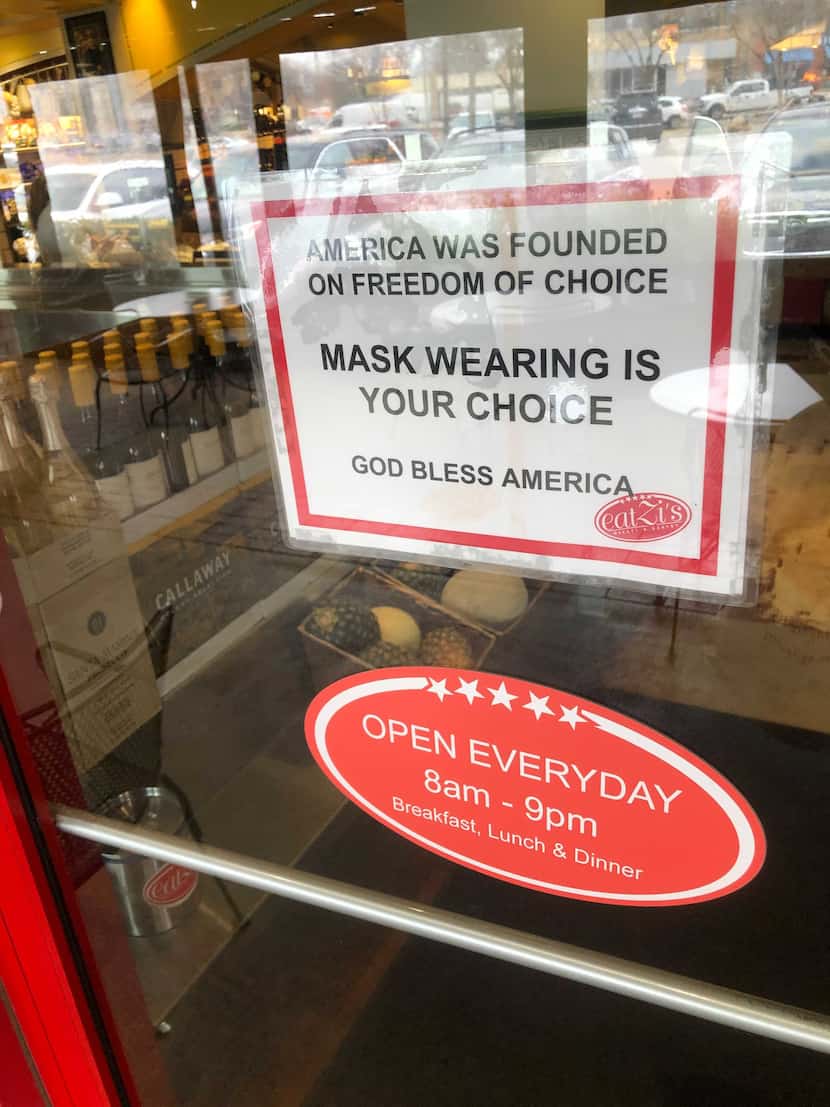 A sign at Eatzi's on Lovers Lane says "mask wearing is your choice."