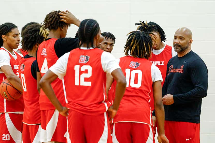 Duncanville boys head basketball coach David Peavy talks to the team during a practice,...