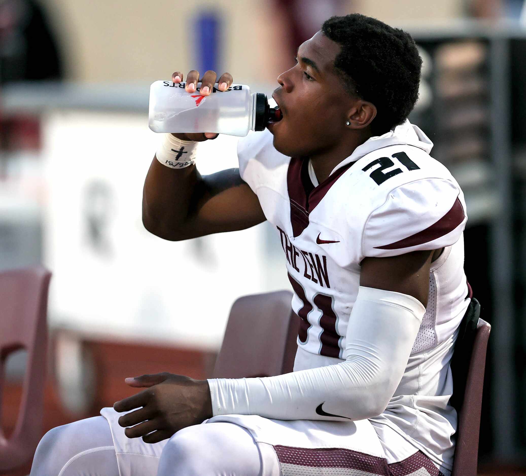 Lewisville running back Viron Ellison takes a break on the bench during the first half of a...