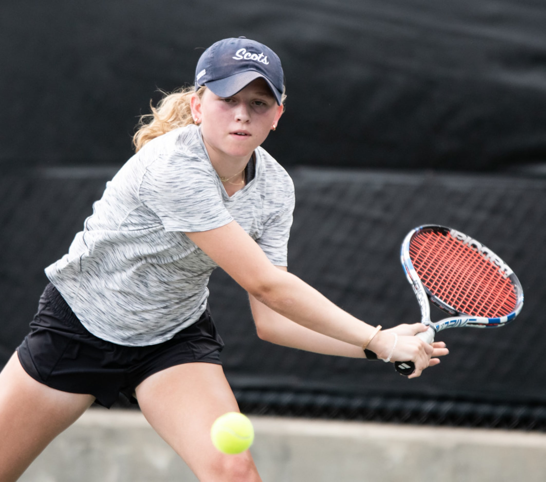 Highland Park's Jourdan Krueger returns the ball in a singles match against Colleyville...