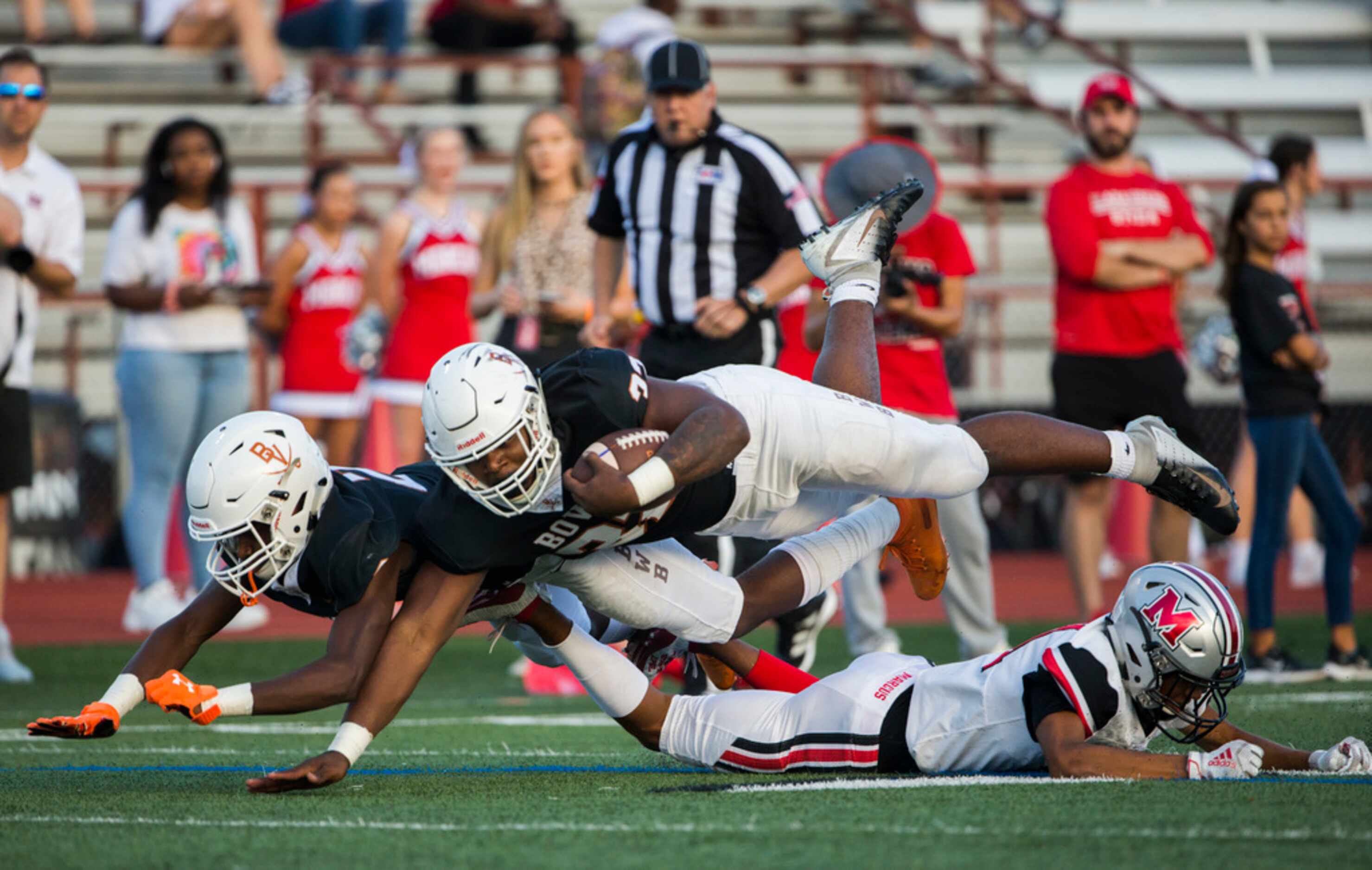 Arlington Bowie running back Marsaillus Sims (32) and wide receiver Paul Alexander (2) are...