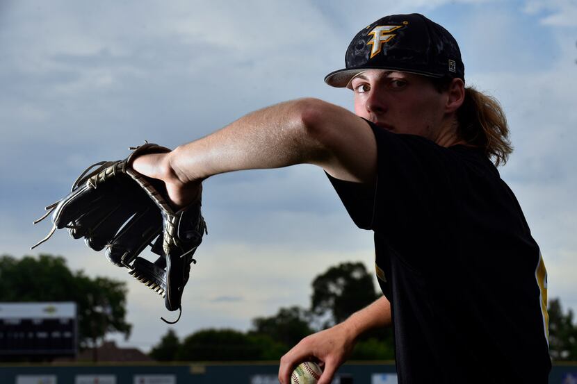 Forney pitcher Mason Englert demonstrates how he throws a fastball during a practice on...