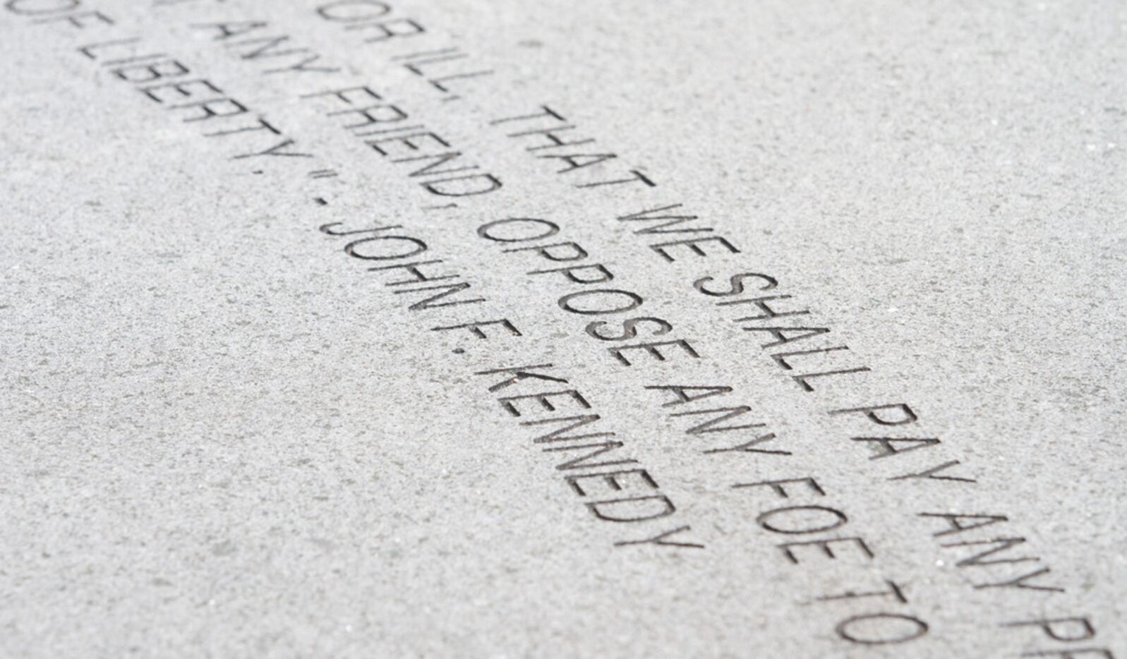 A quote from President John F. Kennedy is in inscribed in the walkway in front of Memorial...