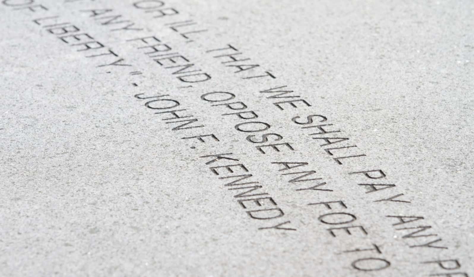 A quote from President John F. Kennedy is in inscribed in the walkway in front of Memorial...