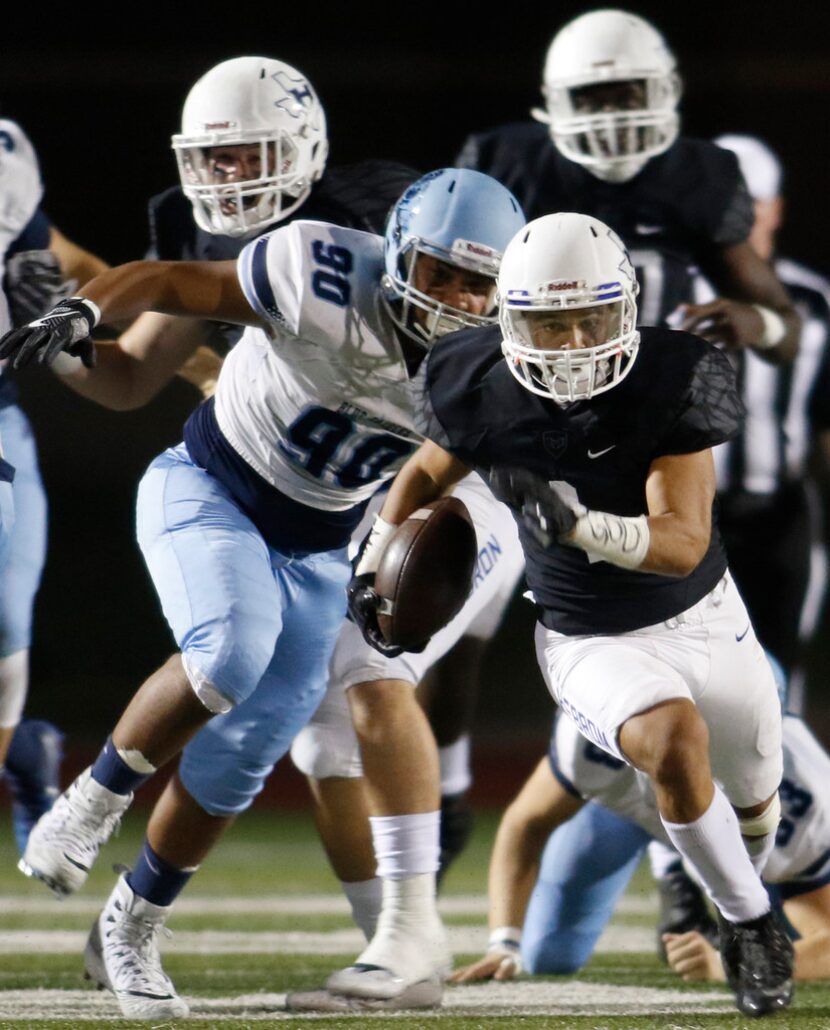 Hebron running back Jatyn Taylor (1) breaks into the L.D. Bell secondary as Blue Raiders...