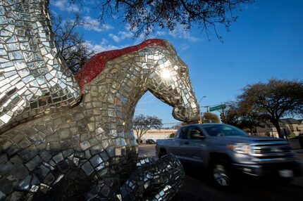 A truck passes a mirrored Pegasus statue in the northeast corner of the Preston Royal...